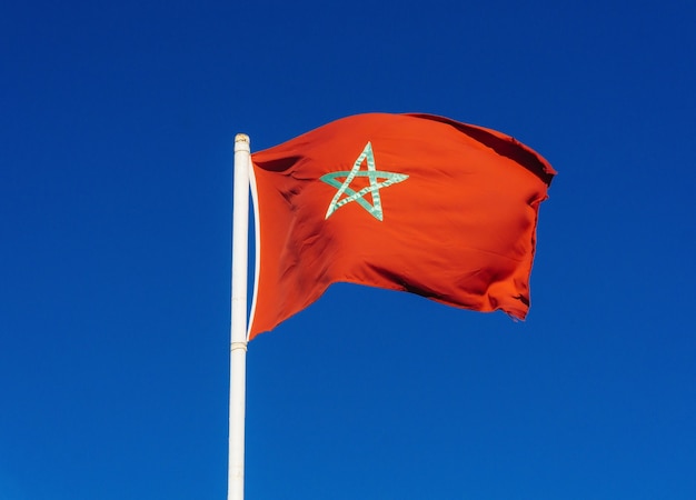 Real flag of morocco on blue sky