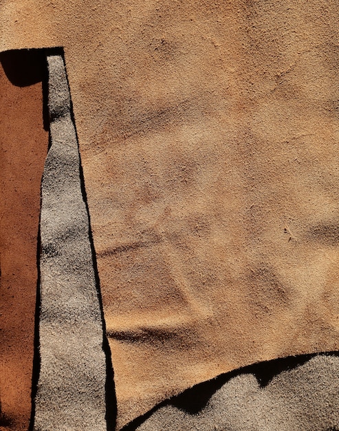 real leather piece brown fabric background