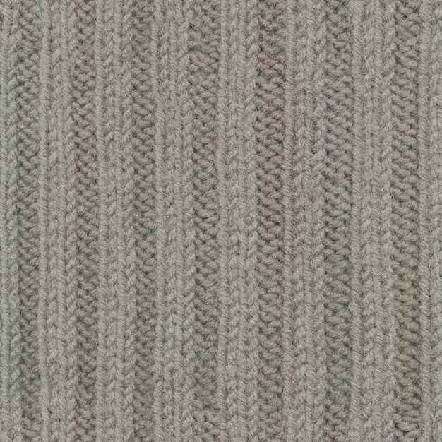 Real nitted elastic band seamless pattern, texture, background. Beige wool yarn