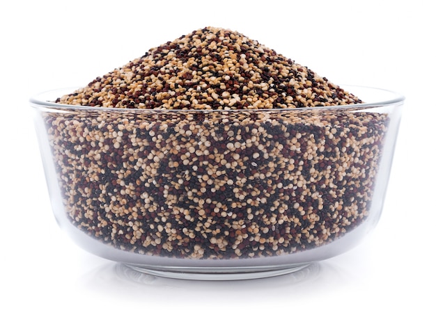 Real quinoa seeds in a bowl isolated on white