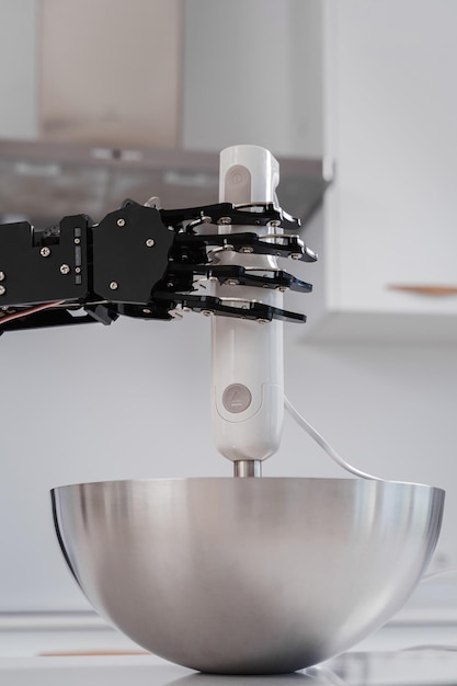 Photo real robot hand and immersion blender concept of robotic process automation