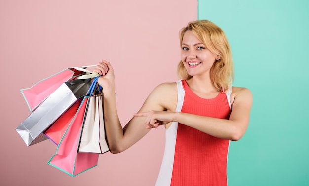 Real sale Woman on shopping tour Girl with paper bags Black friday concept Happy shopping day Retail and consumerism Ecology impact Satisfied with her shopping Discounts and loyalty program