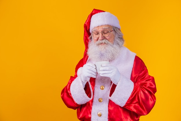 Real Santa holding a cup of coffee