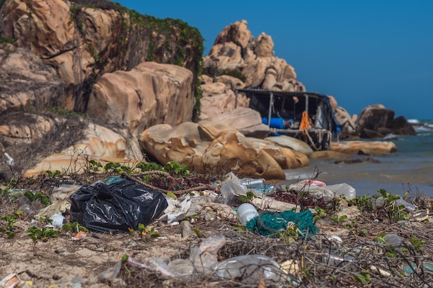 Real sea ocean life climate crisis nature land pollution dirty
beauty rocky beach throwing outdoor plastic litter waste need
environmental protection problem of garbage caused by man made