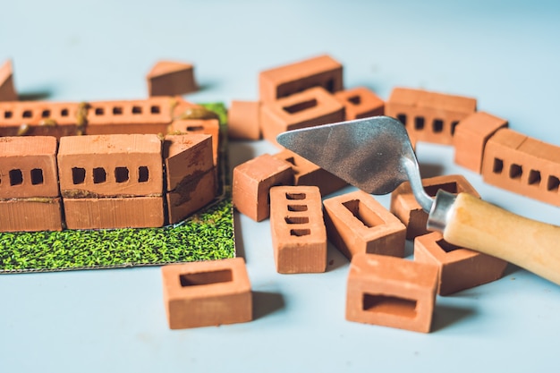 Real small clay bricks at the table