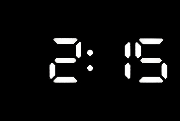 Настоящие белые светодиодные цифровые часы на черном фоне