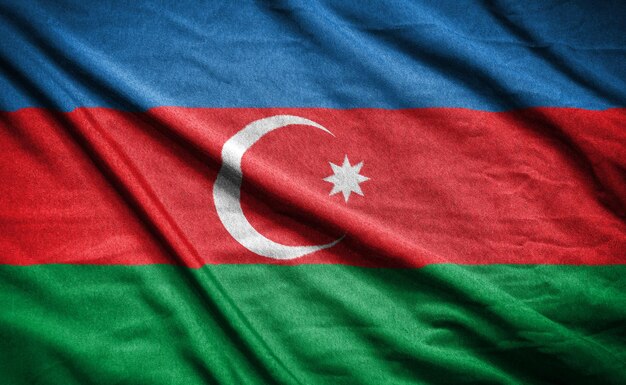 Foto bandiera realistica dell'azerbaigian sulla superficie ondulata del tessuto