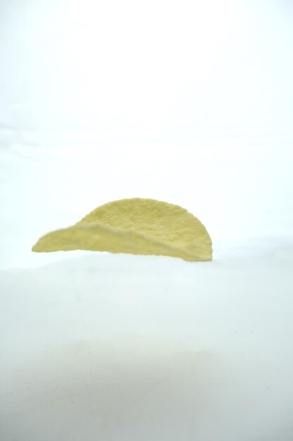 Photo realistic flying potato chip slices