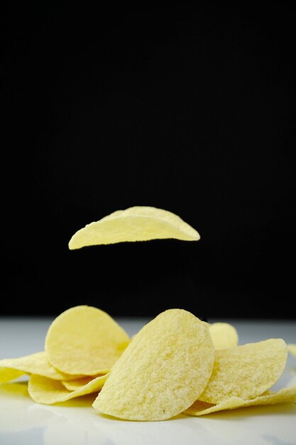 Photo realistic flying potato chip slices