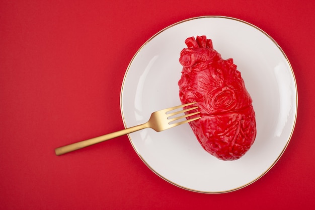 Photo realistic heart on the dining table in the plate