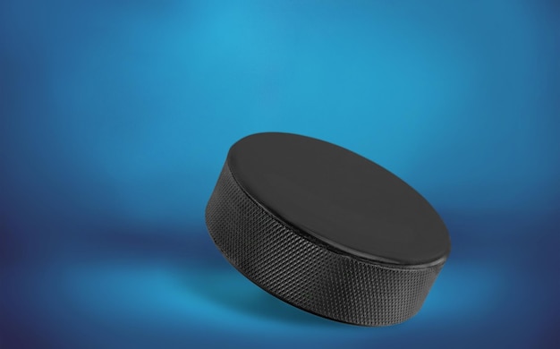 Realistic hockey puck on blue