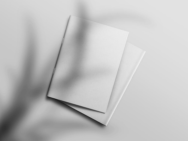 Photo realistic top view cover and opened portrait a4 or a5 magazine or brochure booklet for stationery and branding mockup template isolated light grey background and leaf shadow overlay 3d rendering