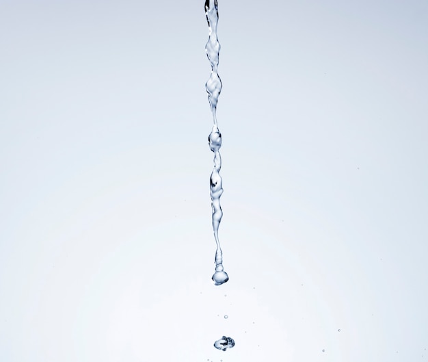 Photo realistic water poured on light background