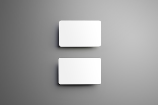 Realistic white two  bank card with shadows on a gray background.