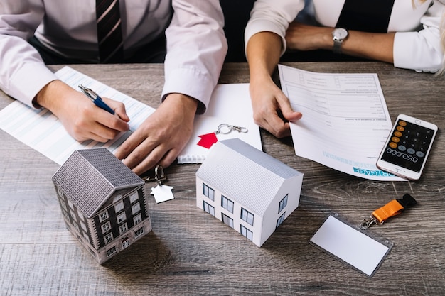 Realtor and client signing documents