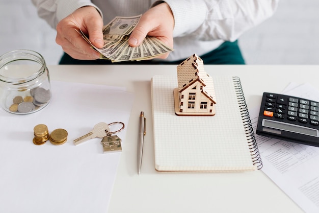 Realtor counting money in office