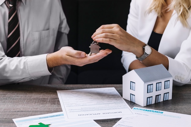 realtor passing key to new owner