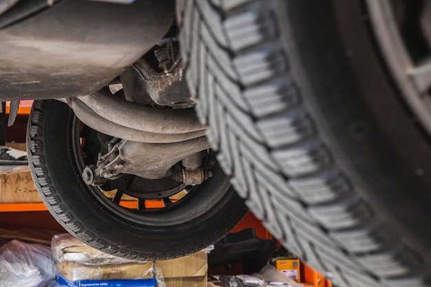 Rear axle of the car which is being inspected in the workshop