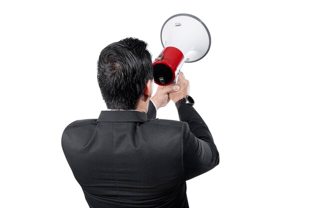 Rear view of Asian businessman shouting on megaphone