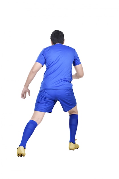Rear view of asian football player in action 