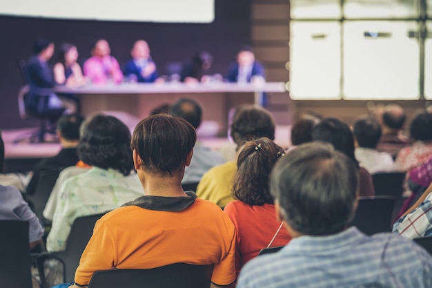 Rear view of Audience in the conference hall or seminar meeting