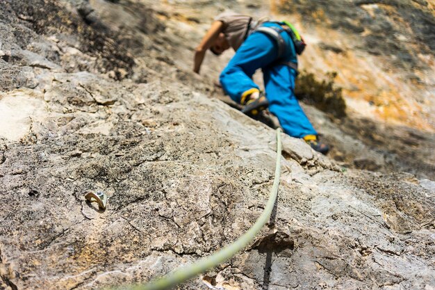 Rear view of boy on rock