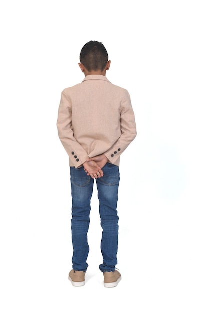 Rear view of  boy with blazer hands on back on white background