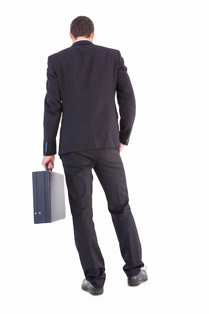 Rear view of businessman holding a briefcase