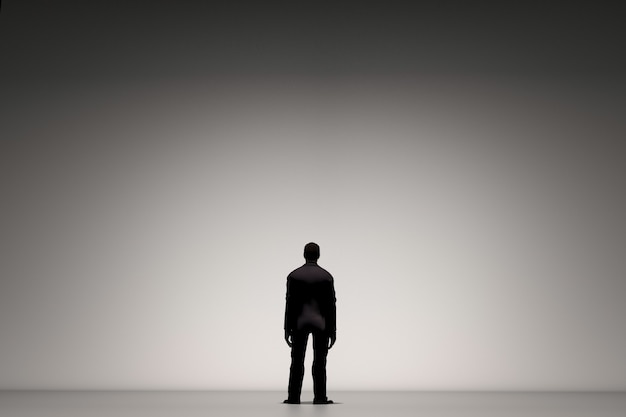 Photo rear view of businessman standing alone