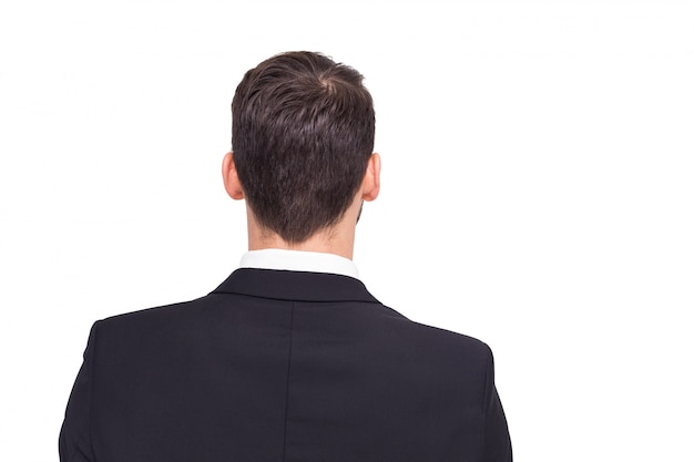 Rear view of businessman in suit standing