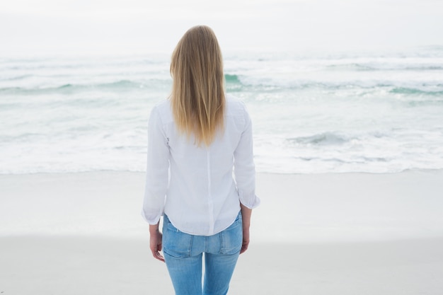 Rear view of a casual blond at beach