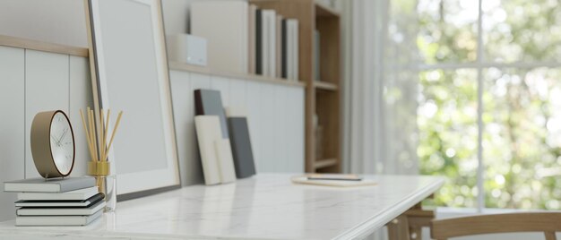 Rear view of copy space on a luxury white table with books alarm clock picture frame