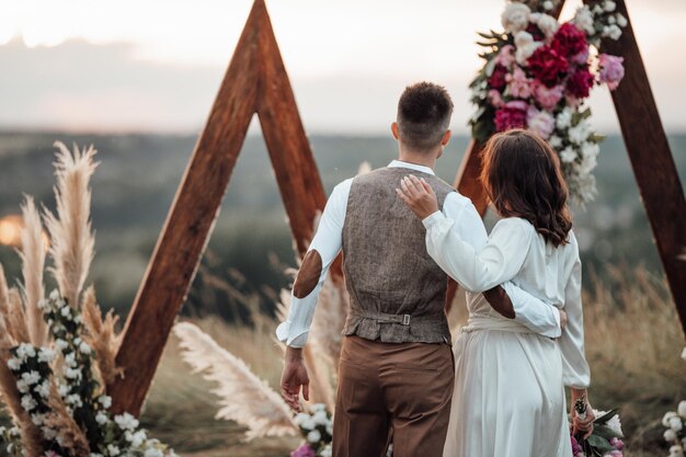 Rear view of couple walking outdoors