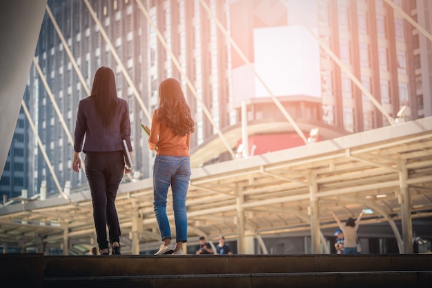 Rear view of Diversity Teenagers climbing stairs 