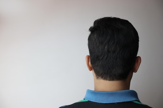 rear view of man against white background