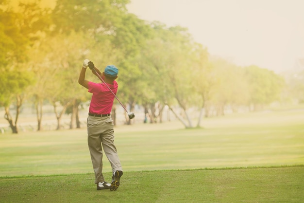 Rear view of man on golf course