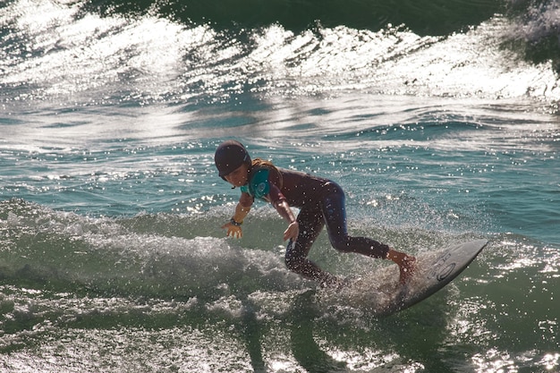 Rear view of man jumping in sea