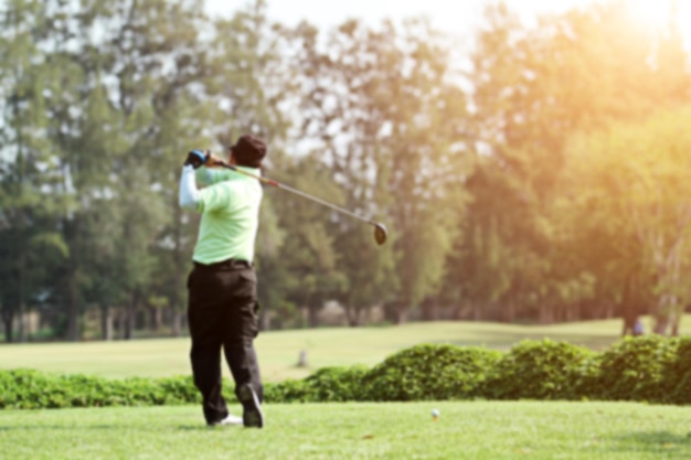 Rear view of man playing golf