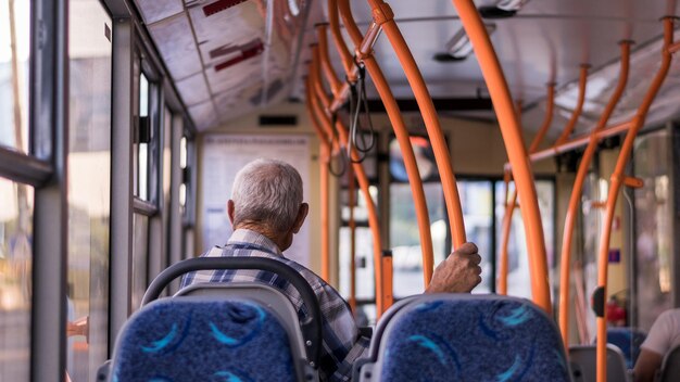 rear view of man sitting in bus