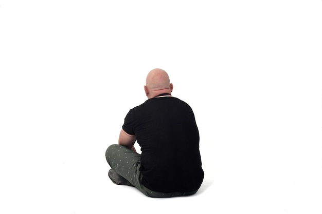 Premium Photo | Rear view of man sitting on floor on white backgound
