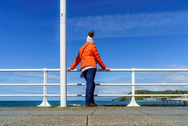 Rear view of man standing against sky