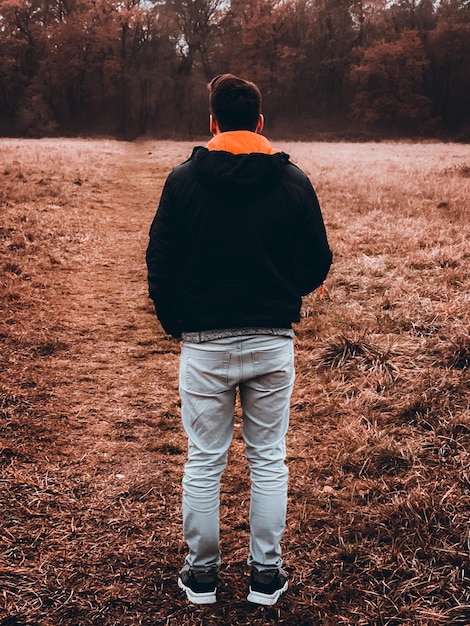 Rear view of man standing on field