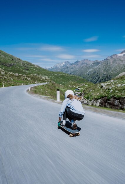 Rear view of man standing on road