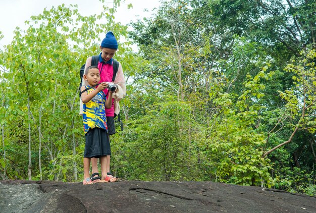 Rear view of man standing on rock