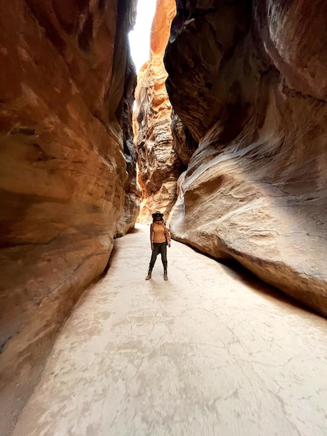 Rear view of man walking in cave