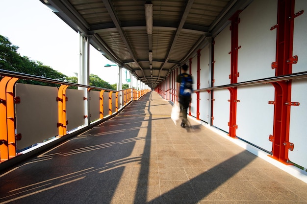 Rear view of man walking in corridor