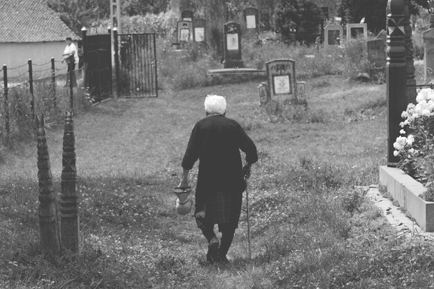 Rear view of man walking on house