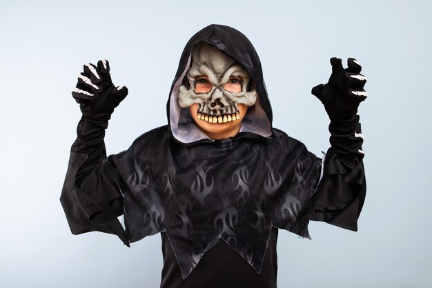 Rear view of man wearing mask against white background