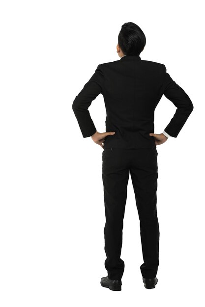 Photo rear view of man with hands on hip standing against white background