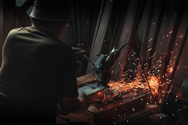 Rear view of man working at workshop